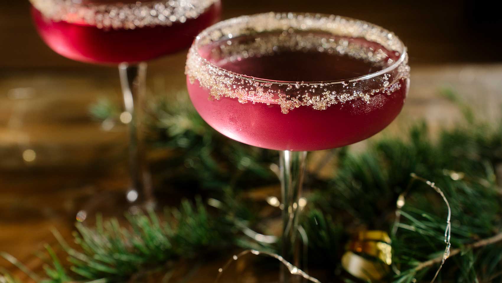 2 Holiday Cocktails with sugar rims