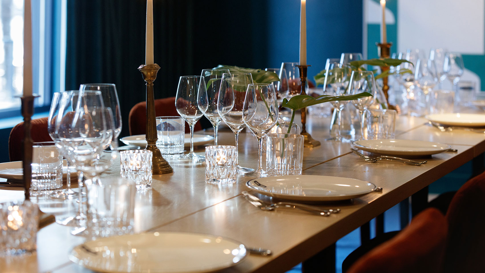 private dining space with royal table set for dinner with candle lights